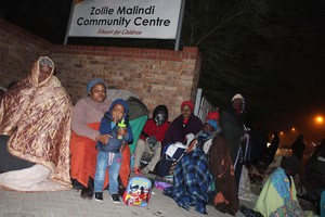 Photo of queue in night at SASSA paypoint