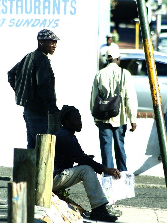 Photo of men by the roadside