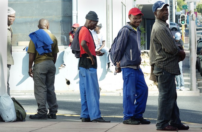 Photo of men at a roadside.