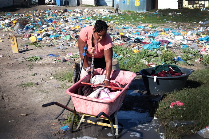 Photo of woman doing her laundry