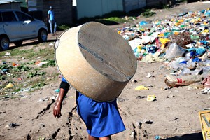 Photo of woman with a bucket