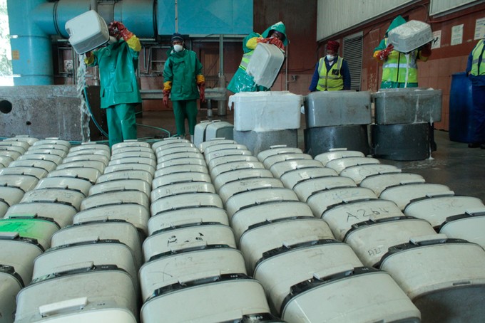 Photo of workers cleaning toilets