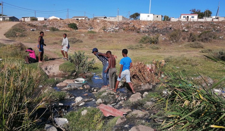 Photo of children crossing river