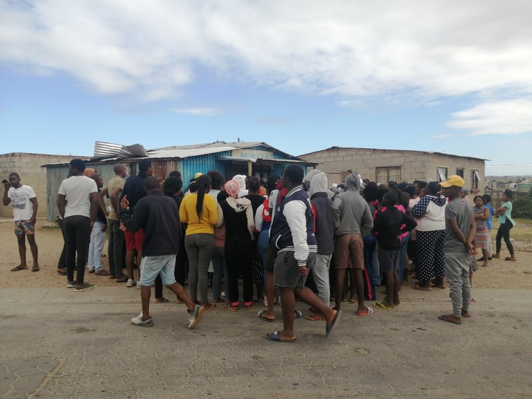 Photo of the community outside the shop