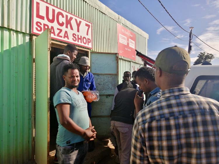 Photo of people outside a shop