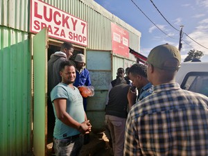 Photo of people outside a shop