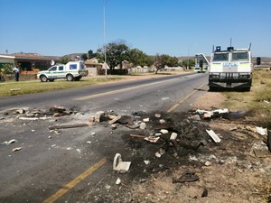 Photo of burned tyres in road