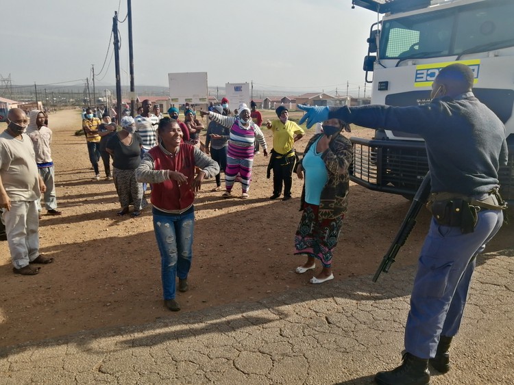 Photo of protesters and a policeman