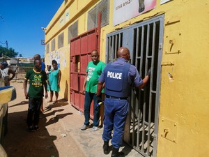 Photo of police at. spaza shop