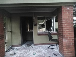 Photo of entrance to guardroom with broken window