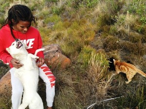 Photo of man with dog and cat