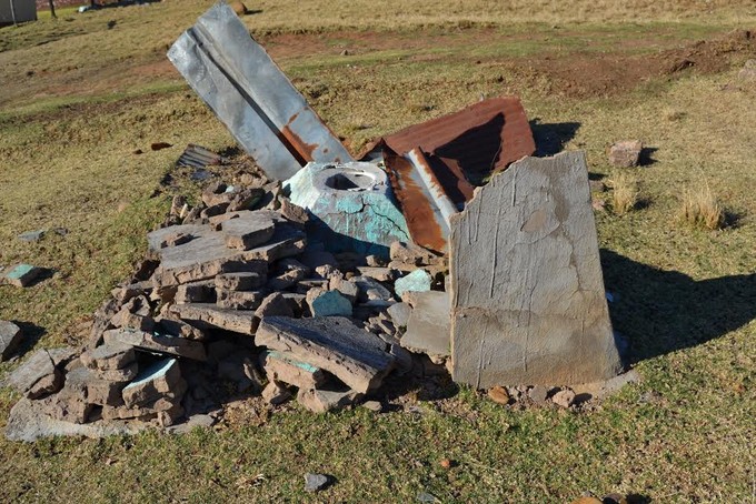 Photo of broken pit toilet