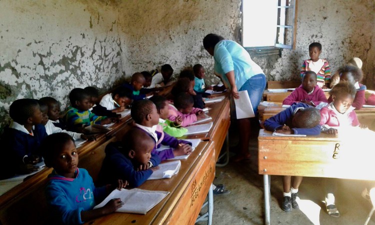 Photo of a classroom full of young kids