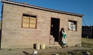 Photo of woman in front of building