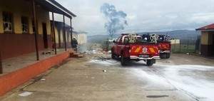 Photo of fire engine and a burnt out building