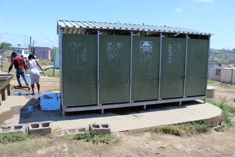 Photo of five toilets in block