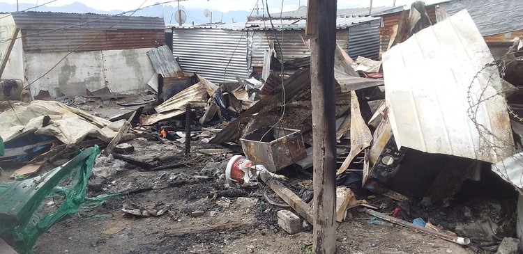 Photo of burnt shacks