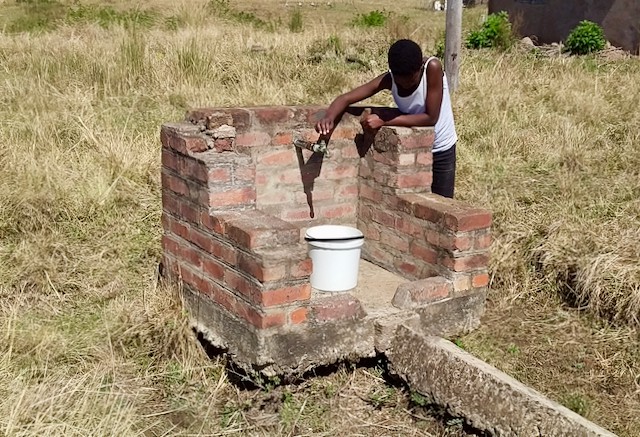 Photo of a person and a tap