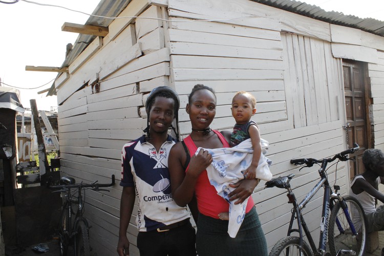 Photo of man, woman and child