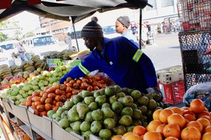 Photo of a man selling fruit