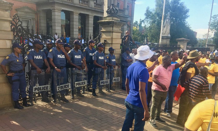 Photo of police in front of marchers