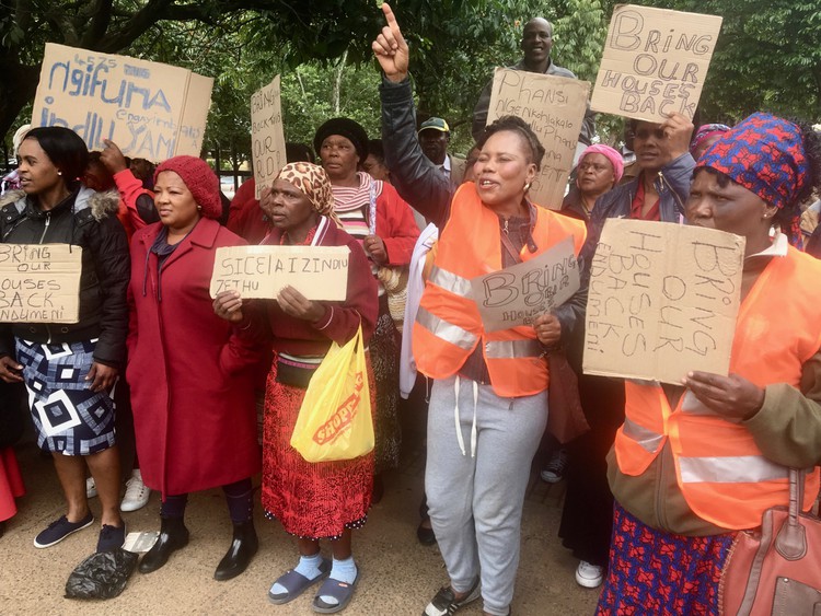 Photo of people protesting with placards