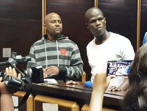 Photo of two men in dock