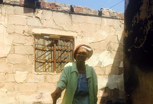 Photo of woman in house with no roof