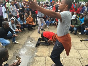 Photo of students demonstrating outside court