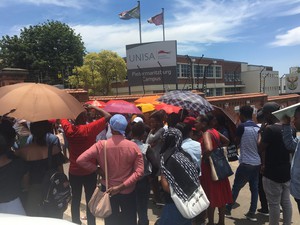 Photo of students outside a gate