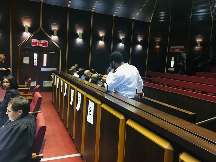 Photo of men in court