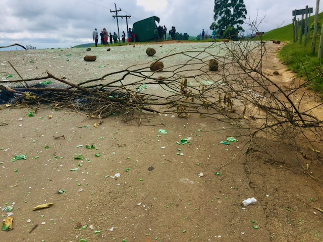 Photo of a rubble strewn road