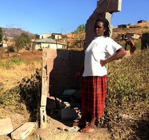 Photo of a woman in front of a toilet