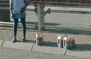 Photo of beer containers on the pavement