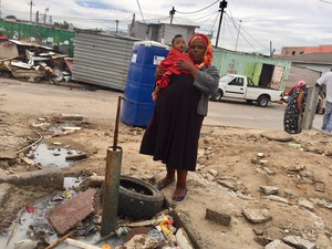 Photo of a woman and a standpipe