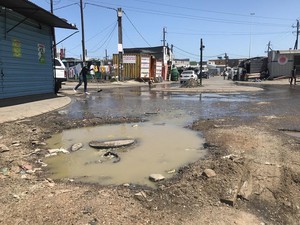 Photo of sewage coming from blocked manhole