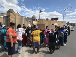 Photo of protesters outside police station