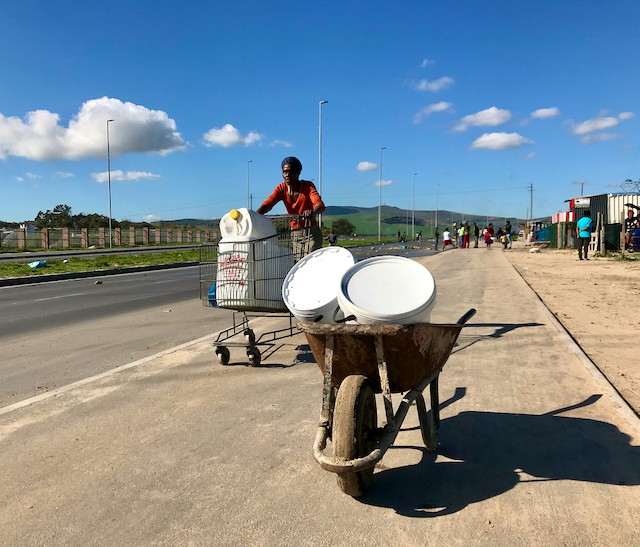 Photo of a person pushing a cart