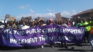 Photo of people marching in street