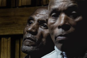 Photo of two miners in court