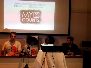 Photo of four people on a speakers' panel