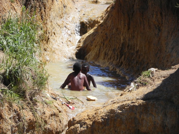 Photo of two boys in a river