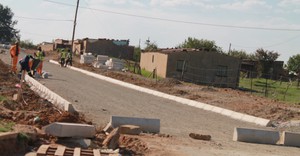 Photo of road with rocks on it