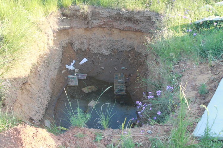 Photo of hole with water  in it