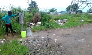 Photo of a child at a tap