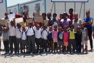 Photo of parents and children picketing a school