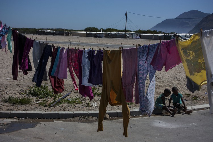 Photo of washing line and vacant land behind