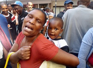 Photo of a woman with a child on her back