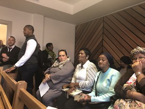 Photo of people in court