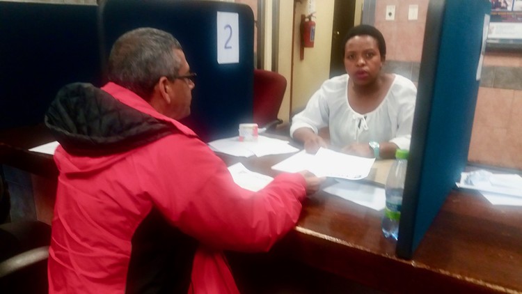 Photo of a man and a woman at a counter